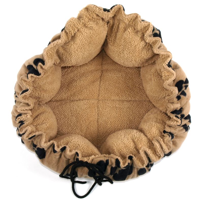 Round, beige cuddly bed with soft fabric and adjustable drawstring. Ideal for pets to sleep or relax.