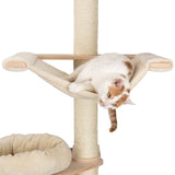 Cat tree with beige fabric hammock and sisal post. Cat lying in the hammock. Padded lying area visible below.