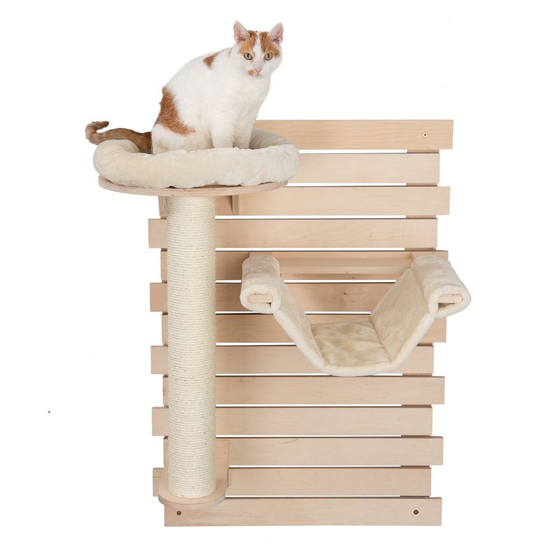 Cat tree made of wood with sisal post, hammock and padded lying surface. Cat sitting on the top lying surface.