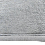 Close-up of grey fabric material with soft, fluffy texture and visible seam.
