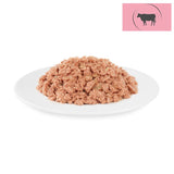 Portion of wet food with beef on a white plate, cow symbol in a pink corner.