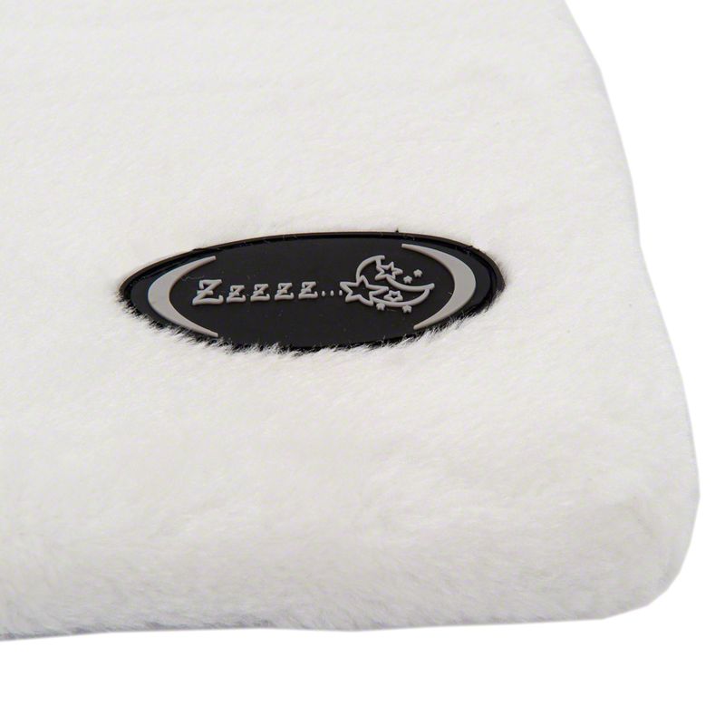 Black emblem with moon and star symbols and the inscription 'Zzzzz...' on white, fluffy material.