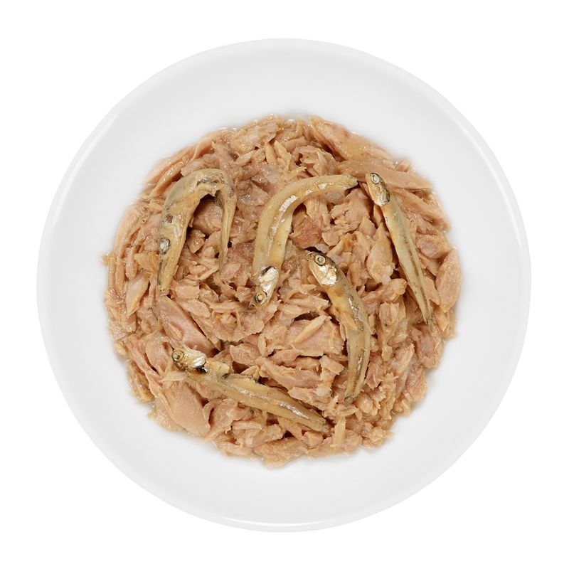 Bowl containing shredded meat mixed with several whole small fish, shown as served for feeding.