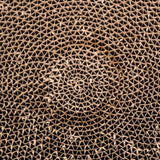 Close-up of a spiral corrugated cardboard structure, suitable for scratching surfaces or cardboard toys.