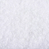 Close-up of white crystalline granules, showing product texture and consistency.