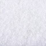 Close-up of white crystals, possibly salt or minerals. No further information visible.