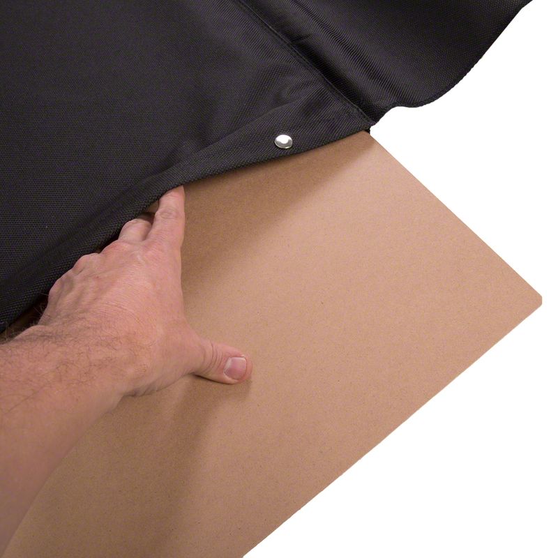 Hand showing insertion of a wooden board into a black fabric bag with press stud closure.