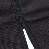 Close-up of a black zip on textured fabric, showing material details and workmanship.