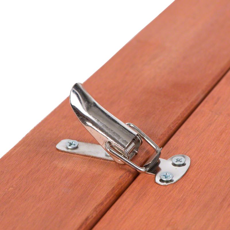Metal fastener on wooden surface, attached with two screws. Suitable for securing flaps or lids.