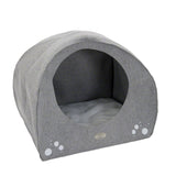 Grey, semi-circular pet bed with soft inner cushion and paw print design on the front.