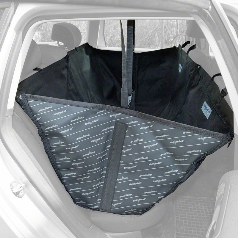 Black car seat cover with small animal mat logo, attached to the back seats of a car. Protection for seat surfaces and side walls, with straps for secure fastening.