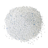 Close-up of white cat litter with blue granules.