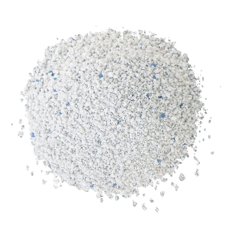 Close-up of white cat litter with blue granules.
