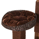 Brown, padded cat bed made of woven material on a scratching post with rope-wrapped columns.