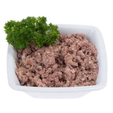 Bowl with shredded meat and fresh parsley as garnish.