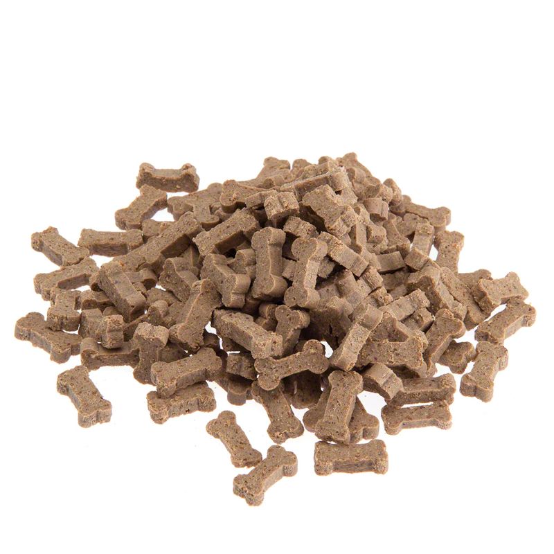 Pile of small, brown, bone-shaped treats displayed on a white background.