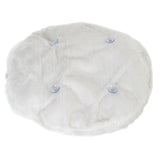 White, round plush cover with four transparent suction cups visible on the surface.