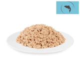 Light, shredded fish on a white plate. Fish symbol on blue background in the top right.