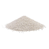 Pile of white, granular material, possibly cat litter or similar product.