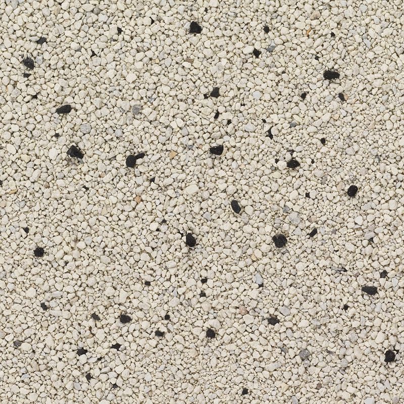 Close-up of white-beige cat litter with scattered black grains.