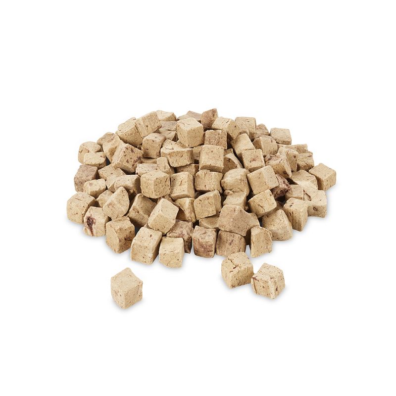 Pile of small, beige-brown cubes made from dried meat. Product image without packaging.