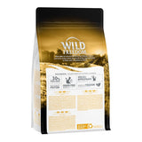 Wild Freedom cat food packaging, visible text: 30% fresh meat, high-quality protein, grain-free recipe, species-appropriate, a taste of freedom, recyclable material. Brand: Wild Freedom.